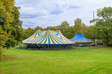 Huge big blue top circus tent built on green grass, Brussels, Belgium