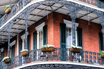 New Orleans, USA Old town street in Louisiana famous city with closeup of typical cast iron balcony...