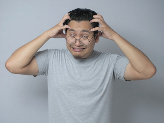 Fototapeta premium Young Man Frustrated, headache, stress and dizzy gesture