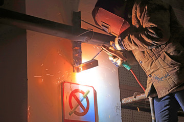 Workers welding operation