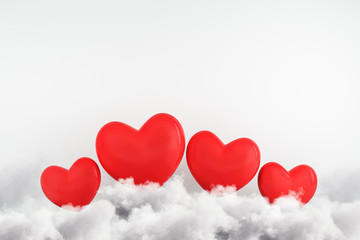 Fototapeta na wymiar Creative red hearts on white background