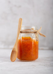 Carrot Jam with orange juice on a gray background