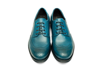 Pair of male cyan leather shoes on white background, isolated product, top view.