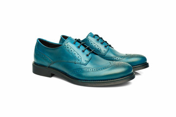 Pair of male cyan leather shoes on white background, isolated product, top view.