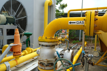Yellow pipe labelled with the word GAS, process piping