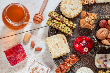 Halawet Al Mawlid Al Nabawi - Collection of traditional candies and sweets with honey jar - Egyptian Culture Dessert usually Eaten During Prophet Muhammad Birth Celebration 