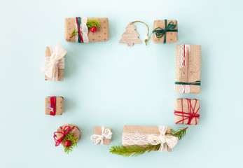 Christmas composition made from little gift boxes. Empty space for your text in the middle