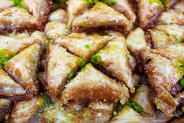 Traditional Middle Eastern dessert baklava with pistachio nuts. A popular pastry made of puff pastry with nuts in syrup.
