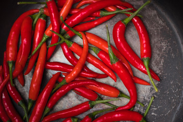 hot peppers, red peppers. A large amount of hot red chili pepper. Spicy, burning vegetable....
