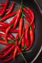 hot peppers, red peppers. A large amount of hot red chili pepper. Spicy, burning vegetable. Delicious food, pepper, vegetable, restaurant, dish