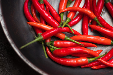 hot peppers, red peppers. A large amount of hot red chili pepper. Spicy, burning vegetable. Delicious food, pepper, vegetable, restaurant, dish