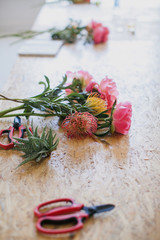 Many different flowers and different colors. For a floristry store. Making bouquets. Peonies, roses and hyacinths.