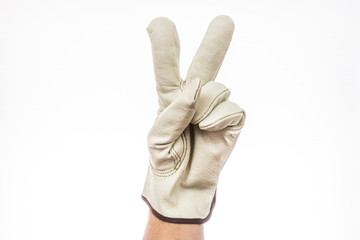 Two fingers up, white leather work gloved hand, peace.