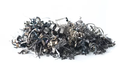 Gordijnen Pile of scrap metal shavings isolated on white background © showcake