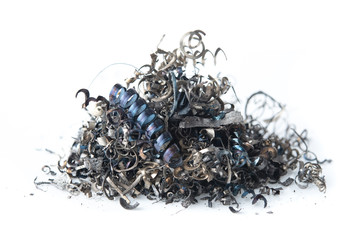 Pile of scrap metal shavings isolated on white background