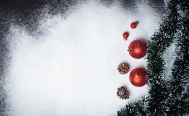 Christmas decoration with balls on snow with copy space