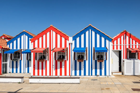 Colorful houses in Costa Nova, Aveiro, Portugal. Street with striped  houses, Costa Nova, Aveiro, Portugal. Facades of colorful houses in Costa  Nova, Aveiro, Portugal Stock Photo | Adobe Stock