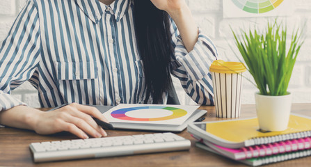 Woman designer working on the project in the office Graphic designer at work.