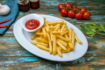 french fries on white plate with ketchup