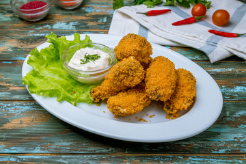 Buffalo chicken wings on wooden table