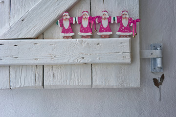 Santa Claus decoration on beautiful wooden white shutter