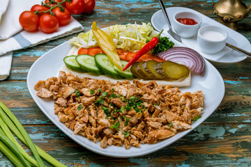 Shawarma on a plate on wooden table
