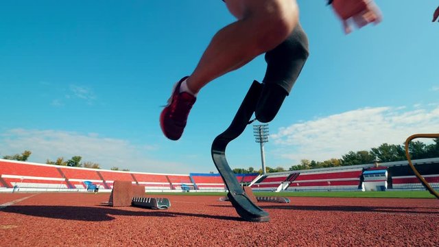 Stadium with disabled athletes jogging