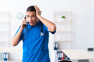 Young male doctor working in the clinic