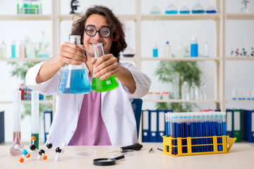Funny male chemist working in the lab