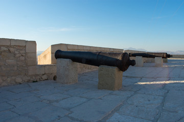 Fototapeta na wymiar 18th century cannon at the top of a castle in Valencia, Spain 