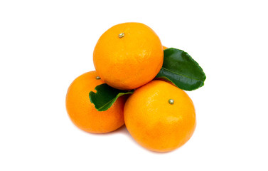 Fresh oranges and leaves are placed on a white background.