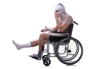 Injured man in wheel-chair isolated on white