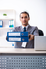 Young male accountant working in the office