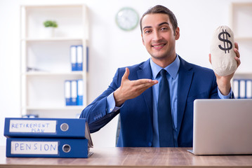 Young male accountant working in the office