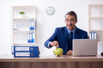 Young male accountant working in the office
