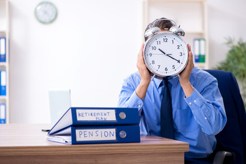 Young male accountant working in the office