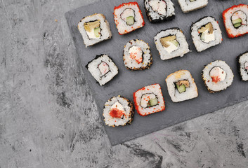 Japanese rolls on stone background.