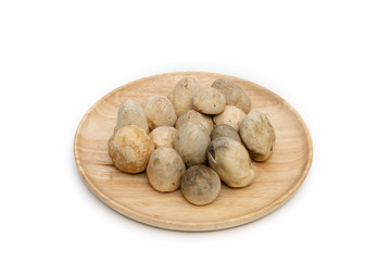 Straw mushroom on wooden dish,isolated on white background