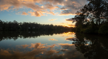 Fototapeta na wymiar Panoramic Sunrise Over River