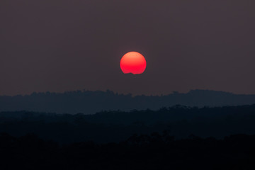 A vivid orange sun due to bushfire smoke in The Blue Mountains, New South Wales, Australia.