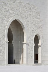 ornate marble walls and arch of grand mosque in abu dhabi uae 
