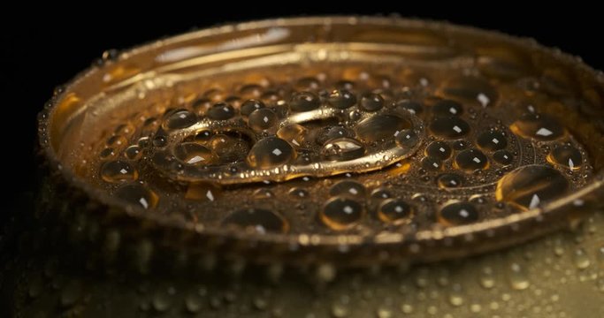 Frame for advertising, alcohol, alcoholic beverages, aluminum container, refreshing taste, cold liquid, drops of water on walls, water balls, can not printed, spinning on pedestal, rotation, macro