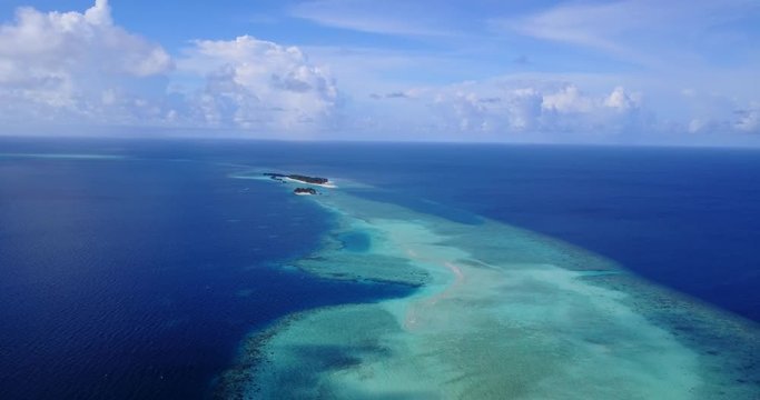 beautiful crystal clear water of Philippine sea with distant uninhabited desert islands aerial tropical ocean background