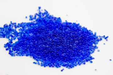 Blue silica gel adsorbs moisture from the air, preventing damage