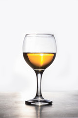 Amber wine. Liquid in a glass. Traditional wine according to ancient Georgian technology. Copy space Macro and vertical orientation.
