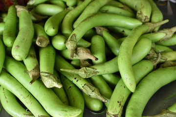 close up of green eggplant in the market for sale