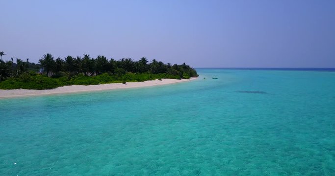 long wide tropical beach, scenic turquoise water and white sand, Tomia Island, Wakatobi marine national park, Indonesia, paradise travel location