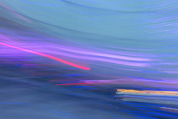 Abstract background of blue and violet light bulbs in motion