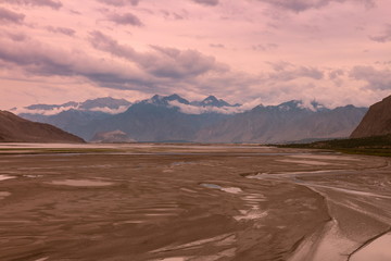 landscape view of the Indus river flowing through Katpana cold desert in Skardu, Gilgit Baltistan, Pakistan.