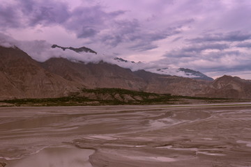 landscape view of the Indus river flowing through Katpana cold desert in Skardu, Gilgit Baltistan, Pakistan.